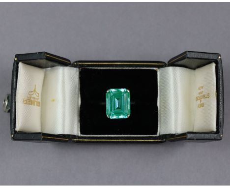 A simulated aquamarine ring, the large rectangular stone of blue-green colour, measuring approx. 15 z 12 x 6 mm, set to a un-