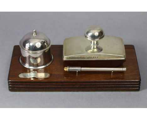 A contemporary silver desk set by Martyn Pugh of Redditch, comprising a cylindrical inkwell with domed hinged lid &amp; blue 