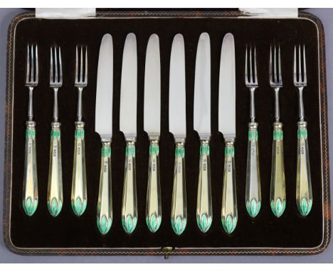 Six pairs of dessert knives &amp; forks with silver-gilt &amp; green enamel Lotus pattern handles (loaded), Sheffield 1929, b