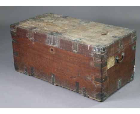 A brass-bound camphor wood trunk with brass swing side handles, 41” wide x 18.75” high x 20.75” deep.