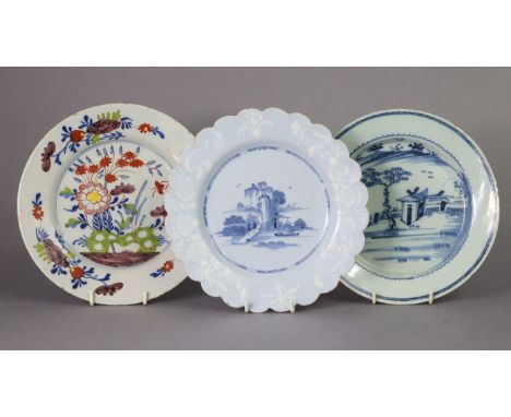 An 18th century Bristol monochrome delft plate with bianco-sopra-bianco border &amp; scalloped rim, the centre painted with a