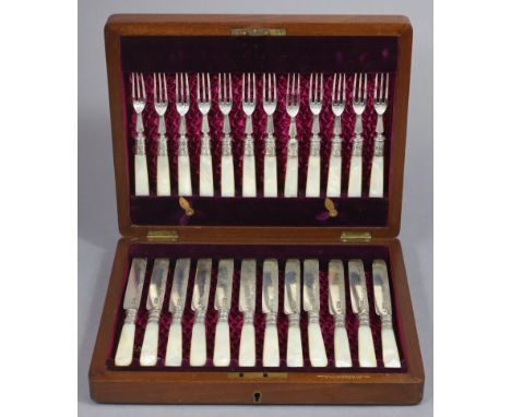 Twelve pairs of Edwardian silver dessert knives &amp; forks with engraved decoration &amp; mother-o’-pearl handles; London 19