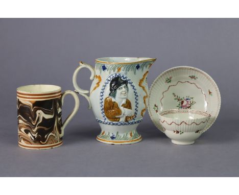 An 18th century Prattware jug decorated on either side with a relief portrait of “The Miser”, 5¼” high (slight fault to spout