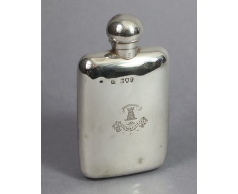 A Victorian silver pocket spirit flask with ball-shaped screw cap, engraved family crest, 5.5” high; London 1894, by W. &amp;