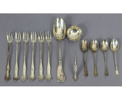 A French .950 standard fancy scroll-pattern dessert spoon; six sterling bead-edge &amp; rose pattern pastry forks; four sterl