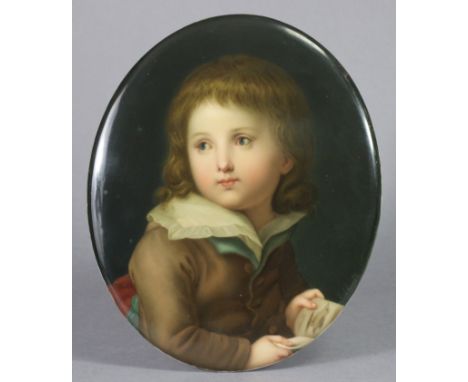 A BERLIN PORCELAIN OVAL PORTRAIT PLAQUE, finely painted with a young boy holding a picture book, signed lower right, impresse