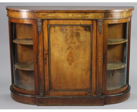 An inlaid walnut Victorian break-front credenza with brass mounts, fitted central shelf enclosed by an inlaid panel door with