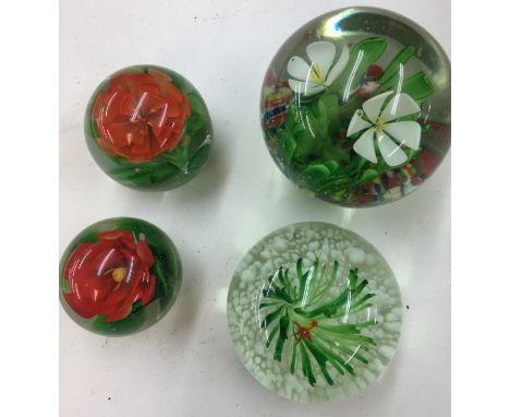 Four vintage paperweights, three with flowers one with fish and frog.all in perfect condition no cracks or damage.