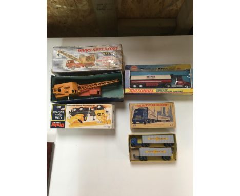 Four boxed vintage cars to inc Dinky.