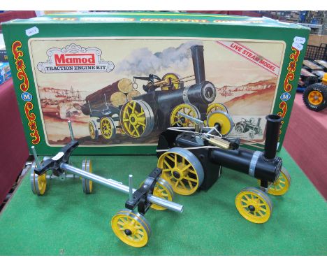 A Mamod 'Build Up' Traction Engine Live Steam Model and Trailer, with original box and literature.