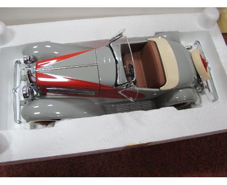 A Franklin Mint 1:24th Scale Diecast Model 1935 Duessenberg SSJ, grey/red paint work, no literature or tag, boxed.