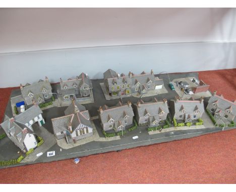 A 'OO' Gauge Street Diorama, including housing, village stores, public house, lamp posts, people, cars (no track), electrics,