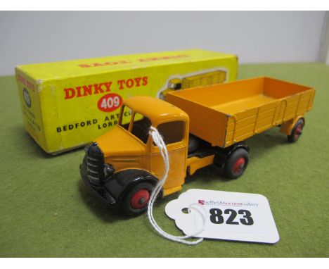 A Boxed Dinky Toys #409 Bedford Articulated Lorry, chipping to paintwork pen writing and wear to box.