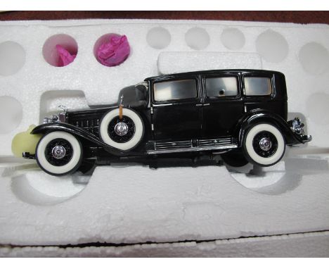 A Franklin Mint 1:24th Scale Diecast Model 1930 V-16 452 Cadillac Imperial Sedan, with tag, gloves, boxed.