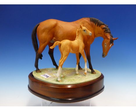 A 1970 ROYAL WORCESTER GROUP OF PRINCESS GRACE &amp; FOAL MODELLED BY DORIS LINDNER.   W 26cms.