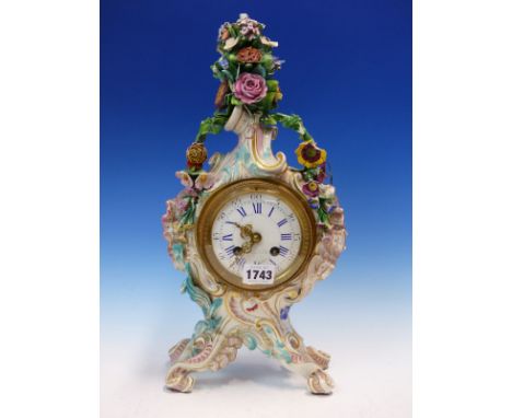 A MEISSEN PORCELAIN FLORAL ENCRUSTED ROCOCO CLOCK CASE ON FOUR LEGS, THE JAPY FRERES MOVEMENT STRIKING ON A BELL, THE ENAMELL