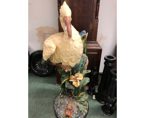 A VINTAGE UMBRELLA STAND IN THE FORM OF A STORK EMERGING FROM REEDS WITH A FROG AT THE BASE.    H.95cms.