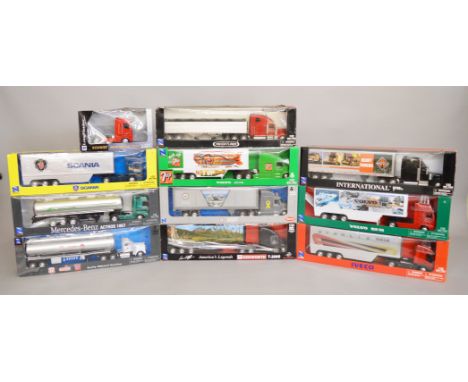 10 boxed NewRay diecast truck models in 1:32 scale, with Peterbilt, Volvo, Kenworth, Scania, Iveco being amongst the marques 