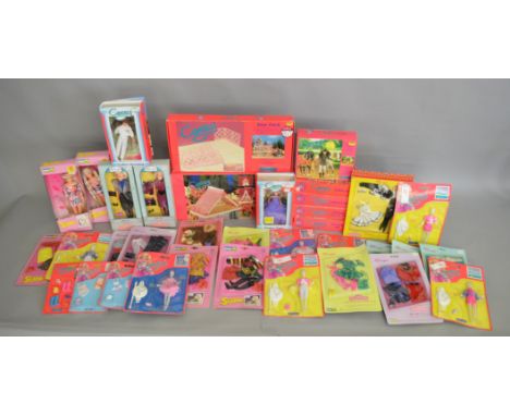A mixed lot which includes; Cassy and Suzie dolls and clothes; Cassy Roof Pack, Cassy Bright Lights outfits by Hornby, Suzie 