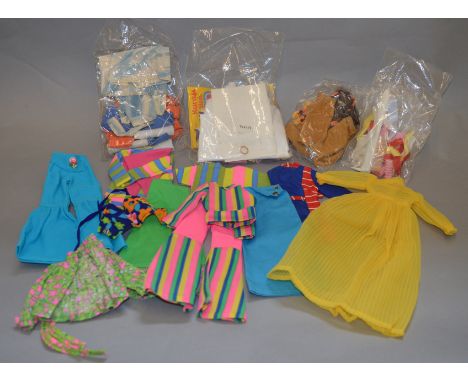 A collection of vintage Tressy doll and Charlie clothing and accessory sets by Palitoy.