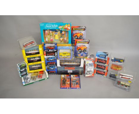 A varied selection of mainly packaged diecast models by Mattel, Cararama, Gilbow and others including a Mattel 'Snow White an