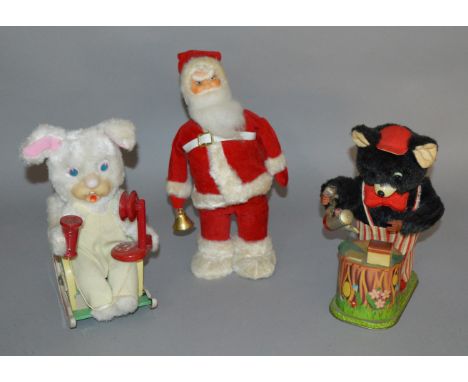 Two unboxed vintage  battery operated tinplate toys including a Modern Toys (Japan) Rabbit figure with telephone, seated on a