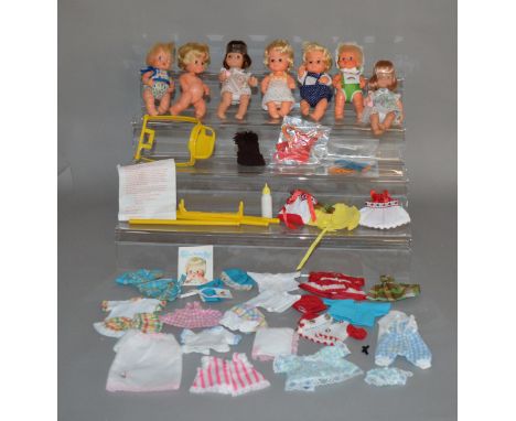 Quantity of 7 vintage fashion baby dolls which includes; Sweet April together with clothes and accessories. 