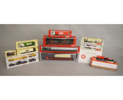 12 plastic model trucks which are mainly 1:87 scale by Herpa, Wiking and others, together with an unboxed Ferrari truck diora