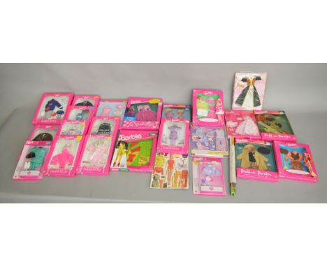 21 boxed Barbie doll outfits by Mattel, these also include outfits for Ken, Skipper, Stacie, Barbie &amp; Shelly, Midge and b