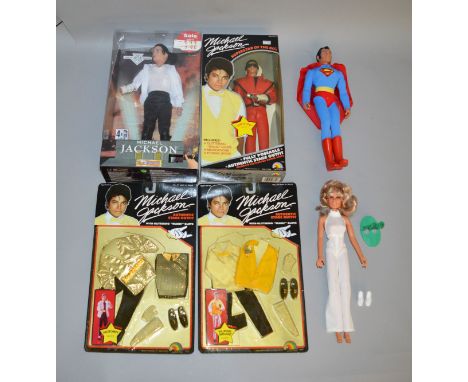 Michael Jackson Poseable and Musical vintage Dolls in original boxes together with two carded outfits together with unboxed '