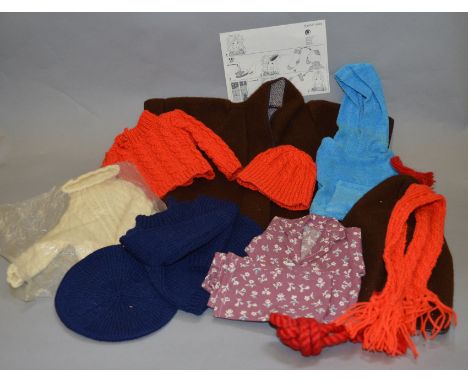 A selection of vintage Sasha doll clothing by Dollytogs, which includes; a brown coat, red jumper etc.