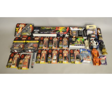 A mixed lot of Star Wars items by mostly Kenner and Hasbro, which includes Star Wars Episode 1 figures, Speeder bike, Luke Sk