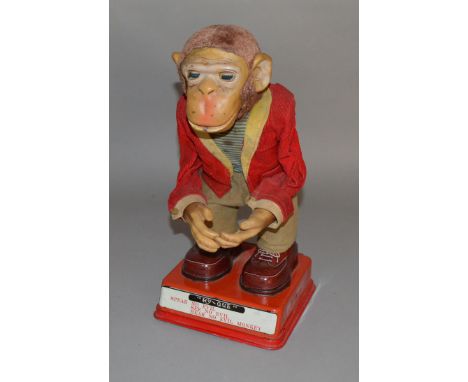 An unboxed and impressive vintage Japanese tinplate battery operated HY-QUE monkey figure by Rosko. The  toy is untested alth