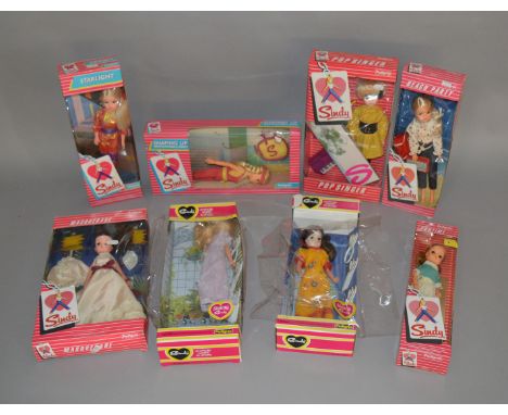 8 vintage Sindy dolls by Pedigree, which includes; Sindy Masquerade, Pop Singer, Shaping up, Beach Party etc, boxes are all G