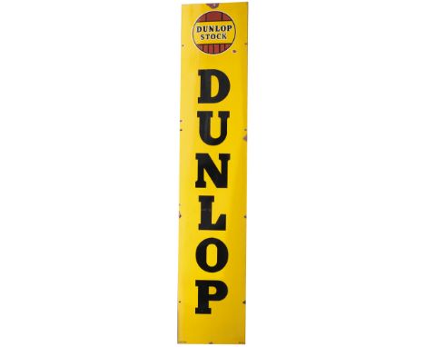 Advertising enamel sign DUNLOP STOCK with DUNLOP in large vertical text. In very good condition with minor chipping. Measures