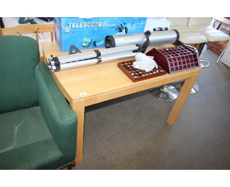 A modern light beech dining room table 
