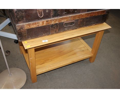A modern light wood two tier coffee table