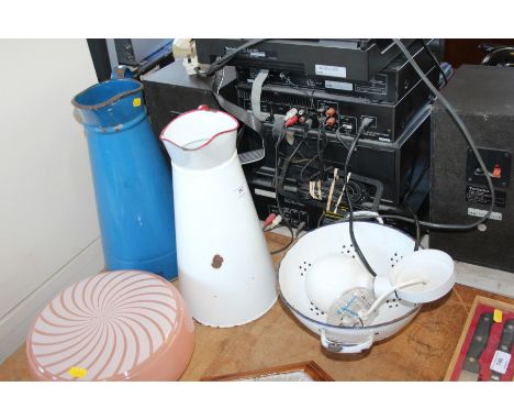 Two enamel jugs; a colander etc.