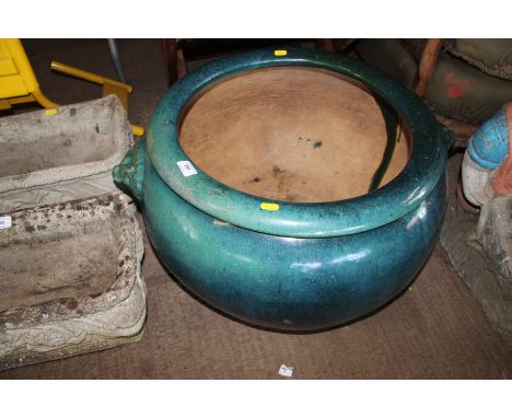 A large Chinese green glazed garden planter  