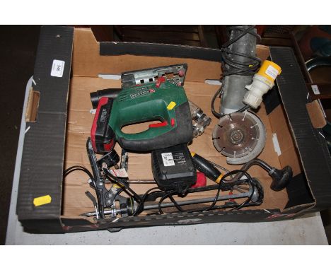A 110v angle grinder; a Parkside jigsaw; various other tools and a stool