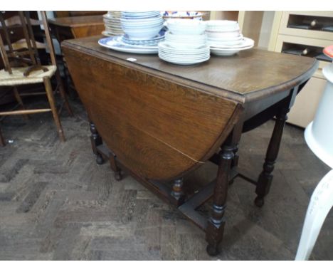 3" 6' oval oak gate leg dining table on turned legs