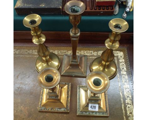2 pairs of brass candlesticks and another odd stick