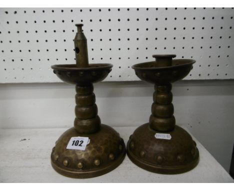 A pair of candlesticks and a cigar lighter