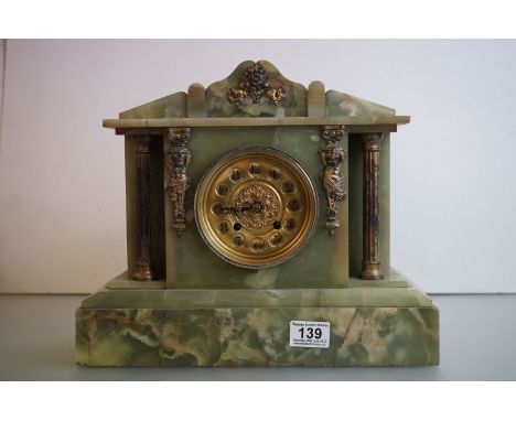 A late 19th / early 20th century green onyx mantle clock with gilt decoration. 