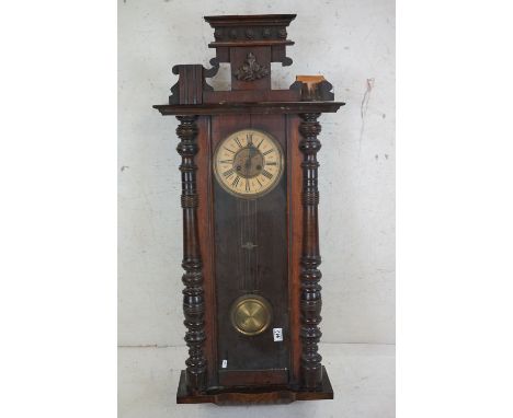 A vintage wooden cased Vienna style wall clock. 