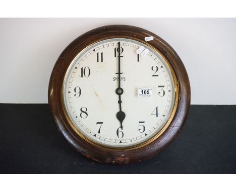 Early 20th century Smiths 8 Day Circular Oak Cased Station / School type Clock, the dial with Arabic numerals and fast / slow