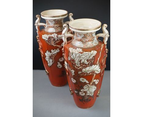 Pair of ceramic Japanese twin-handled vases with prunus decoration, signed to base 