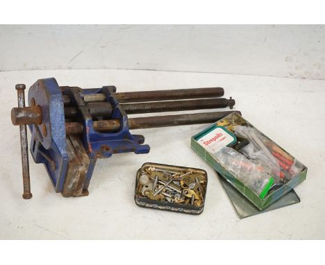 A small collection of clock keys &amp; tools, watch maker tools and a large bench vice.