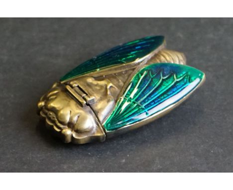 Brass cased bug vesta with enamel wings 