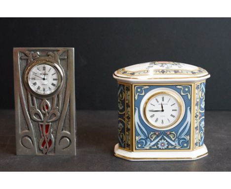 Art Nouveau style St Justin pewter clock, together with a Wedgwood ceramic clock with blue elephant design 
